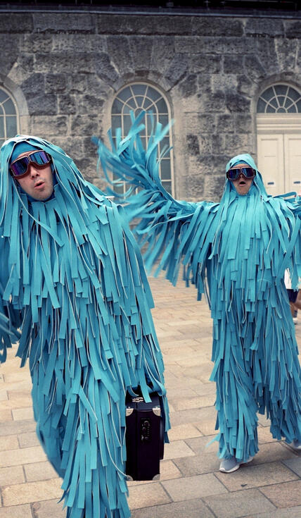 Partygoers in blue costumes Partygoers in blue costumes
