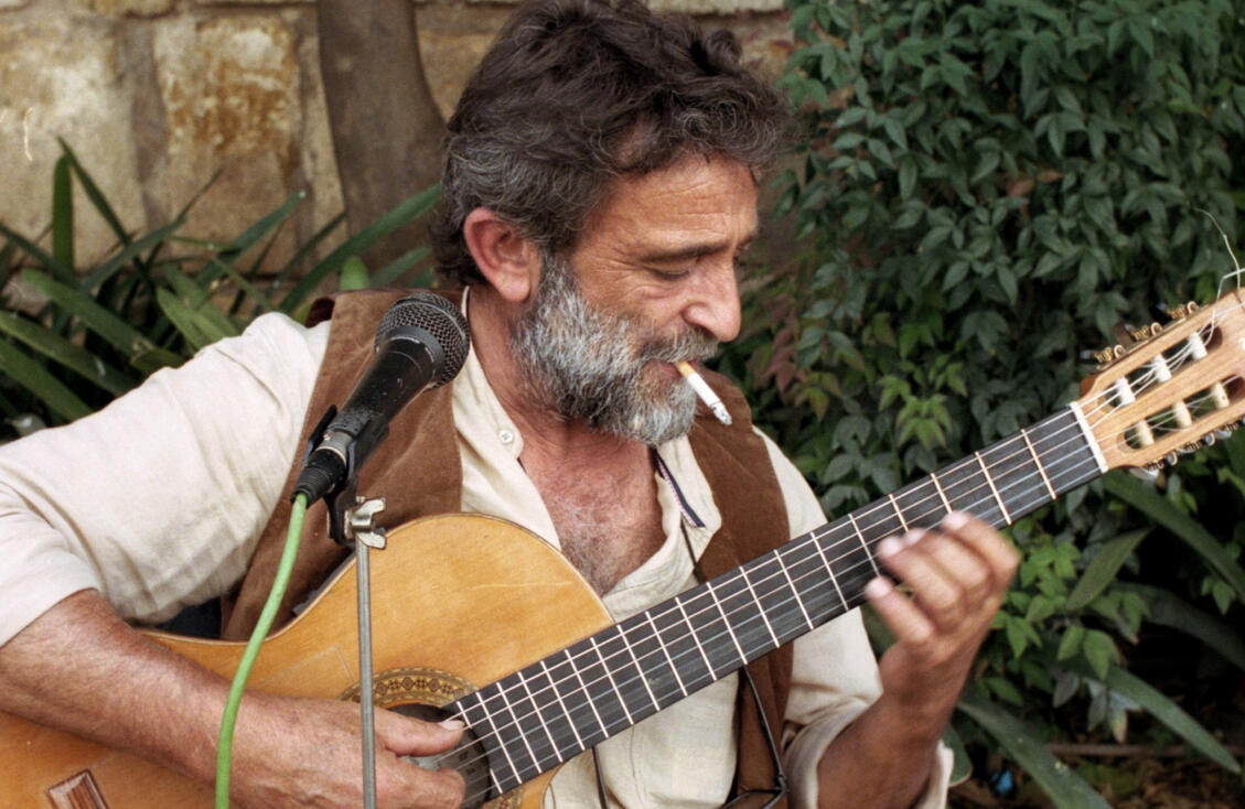 Street guitarist playing in Seville Street guitarist playing in Seville