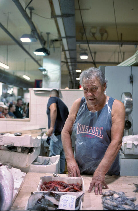 Worker at a Sardinian fish market Worker at a Sardinian fish market