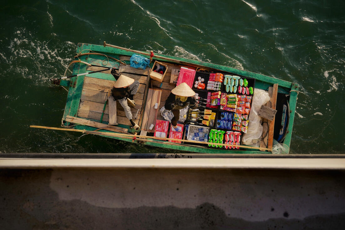 Aerial view of a floating shop boat laden with goods, Halong Bay Aerial view of a floating shop boat laden with goods, Halong Bay